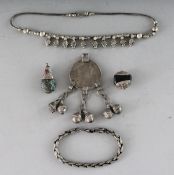 AN ISLAMIC SILVER NECKLACE with a coin, TWO PENDANTS AND CHAIN and BRACELET (4).