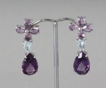 A PAIR OF SILVER AND BLUE TOPAZ LONG DROP EARRINGS.