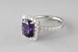 A GOOD 18CT WHITE GOLD, AMETHYST AND DIAMOND RING.