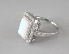 A SILVER, GILSON OPAL AND CZ RING.