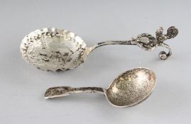 A GEORGE IV SILVER FIDDLE PATTERN CADDY SPOON, Birmingham 1826, and A DUTCH SPOON (2).