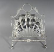 A SILVER PLATE SHELL SHAPED BISCUIT AND CHEESE STAND. 11ins high.