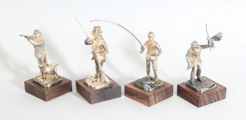 A SET OF FOUR SMALL CAST SILVER FIGURES, 