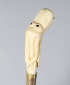 A CARVED BONE OCTOPUS HANDLE WALKING STICK. 35ins long.