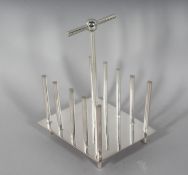 A PLAIN CHRISTOPHER DRESSER DESIGN TOAST RACK.