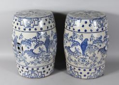 A PAIR OF CHINESE BLUE AND WHITE BARREL SEATS. 18ns high.