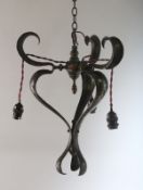 AN ART NOUVEAU HAMMERED CHANDELIER. 18ins.