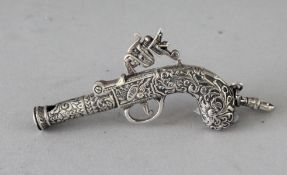 A NOVELTY SILVER GUN WHISTLE. 2.5ins.