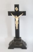 AN 18TH CENTURY ITALIAN CARVED IVORY CORPUS CHRISTI on a wooden cross. 20ins high.