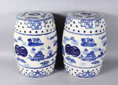 A PAIR OF CHINESE BLUE AND WHITE BARREL SEATS. 18ns high.