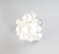 A SILVER, PEARL AND CZ RING.