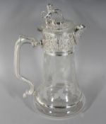 A GOOD GLASS CLARET JUG, engraved with fruiting vines, with plated lid and handle. 11ins high.