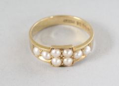 AN 18CT GOLD AND PEARL RING.