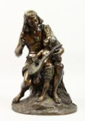 A GOOD 19TH CENTURY CAST BRONZE GROUP of a seated fisherman teaching his son to play the mandolin.