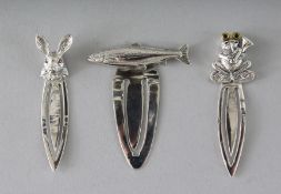 THREE NOVELTY SILVER BOOKMARKS.
