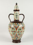A LARGE TURKISH POTTERY TWO-HANDLED VASE AND COVER. 24ins high.
