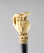 A FINELY CARVED HAND AND WOODEN BACK SCRATCHER. 20ins long.