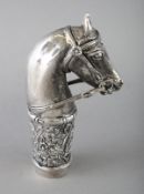 A WHITE METAL HORSES HEAD CANE HANDLE. 3.5ins.