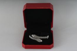 A SILVER MARCASITE DOUBLE SNAKE BRACELET.