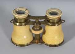 AN IVORY CASED PAIR OF OPERA GLASSES. 2.25ins, closed.