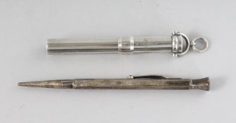 A SILVER PENCIL and A VICTORIAN SILVER TUBE (2).