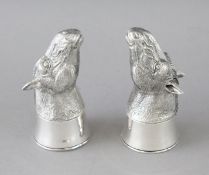 A PAIR OF CAST 800 HORSES HEAD SALT AND PEPPERS. 2.75ins high.