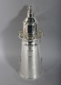 A SILVER PLATED LIGHTHOUSE COCKTAIL SHAKER. 14ins high.