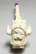 A GOOD LARGE MEERSCHAUM PIPE, the bowl carved as a Viking, in a fitted case. 16ins long.