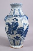 A CHINESE YAN STYLE BLUE & WHITE TWIN HANDLE PORCELAIN VASE, decorated with scenes of a warrior upon