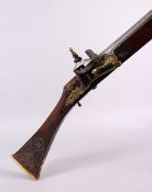 A LONG 19TH CENTURY NORTH AFRICAN RIFLE, with gilt metal mounts, octagonal barrel, with bone and