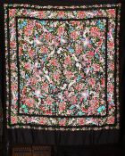 A CHINESE EMBROIDERED SILK PIANO SHAWL, black ground embroidered with birds and flower, 105cm x