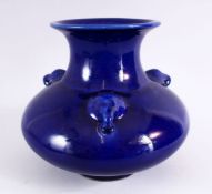 A CHINESE BLUE GROUND TRIPLE HANDLE PORCELAIN VASE, With a deep royal blue ground, with triple
