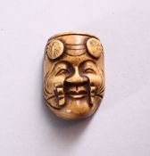 A SMALL CARVED BONE NOH MASK, 3.5cm.