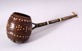 AN UNUSUAL 19TH CENTURY COCONUT WATER SCOOP, with horn handle and bone inlaid decoration, 33cm