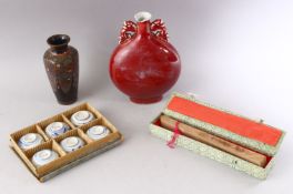 A SMALL JAPANESE CLOISONNE VASE, 15cm high, together with a sang de boeuf vase, a set of six cups