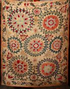 AN EARLY SUZANI TEXTILE consisting of five stitched panels embroidered with palmettes and stylised