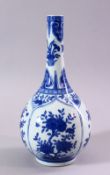 A SMALL CHINESE BLUE AND WHITE BOTTLE VASE, painted with panels of flowers, 23cm