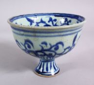 A CHINESE BLUE & WHITE PORCELAIN STEM CUP - FOR THE ISLAMIC MARKET, decorated with scrolling flora