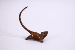 A JAPANESE BRONZE FIGURE OF A RAT , looking aloft with his tail raised, stamped seal to base, 8cm.