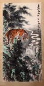A GOOD 20TH CENTURY CHINESE SCROLL PAINTING, depicting a growling tiger standing on a rocky