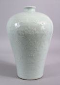 A CHINESE CELADON CARVED PORCELAIN MEIPING LOTUS VASE - FOR THE ISLAMIC MARKET, carved with scenes