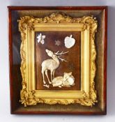 A SMALL JAPANESE CARVED IVORY AND MOTHER OF PEARL PICTURE, depicting a stag and a doe, mounted in