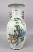 A CHINESE REPUBLIC STYLE FAMILLE ROSE PORCELAIN TWIN HANDLE VASE, decorated with figures in a