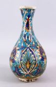 AN EARLY PERSIAN POTTERY BOTTLE VASE, with formal floral motif, 30cm, (AF)