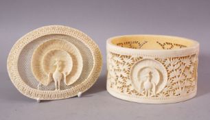A FINE EARLY 20TH CENTURY IVORY TUSK BOX AND COVER, the cover pierced and carved with a peacock, the