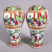 A PAIR OF 19TH CENTURY CHINESE FAMILLE ROSE CANTON PORCELAIN MEIPING VASES, each decorated with