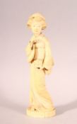 AN EARLY 20TH CENTURY JAPANESE CARVED IVORY OKIMONO OF A GEISHA GIRL, mark to base, 20cm high.