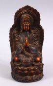 A GOOD CHINESE CARVED IVORY STYLE FIGURE OF SEATED GUANYIN, seated upon a lotus base, with her hands