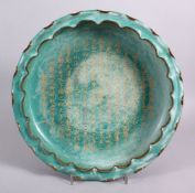 A CHINESE SONG STYLE CALLIGRAPHIC PORCELAIN MOULDED DISH, the dish with a moulded edge, with gilt