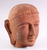 A GOOD HEAVY CARVED STONE BUST of an Indian female, 28cm high.